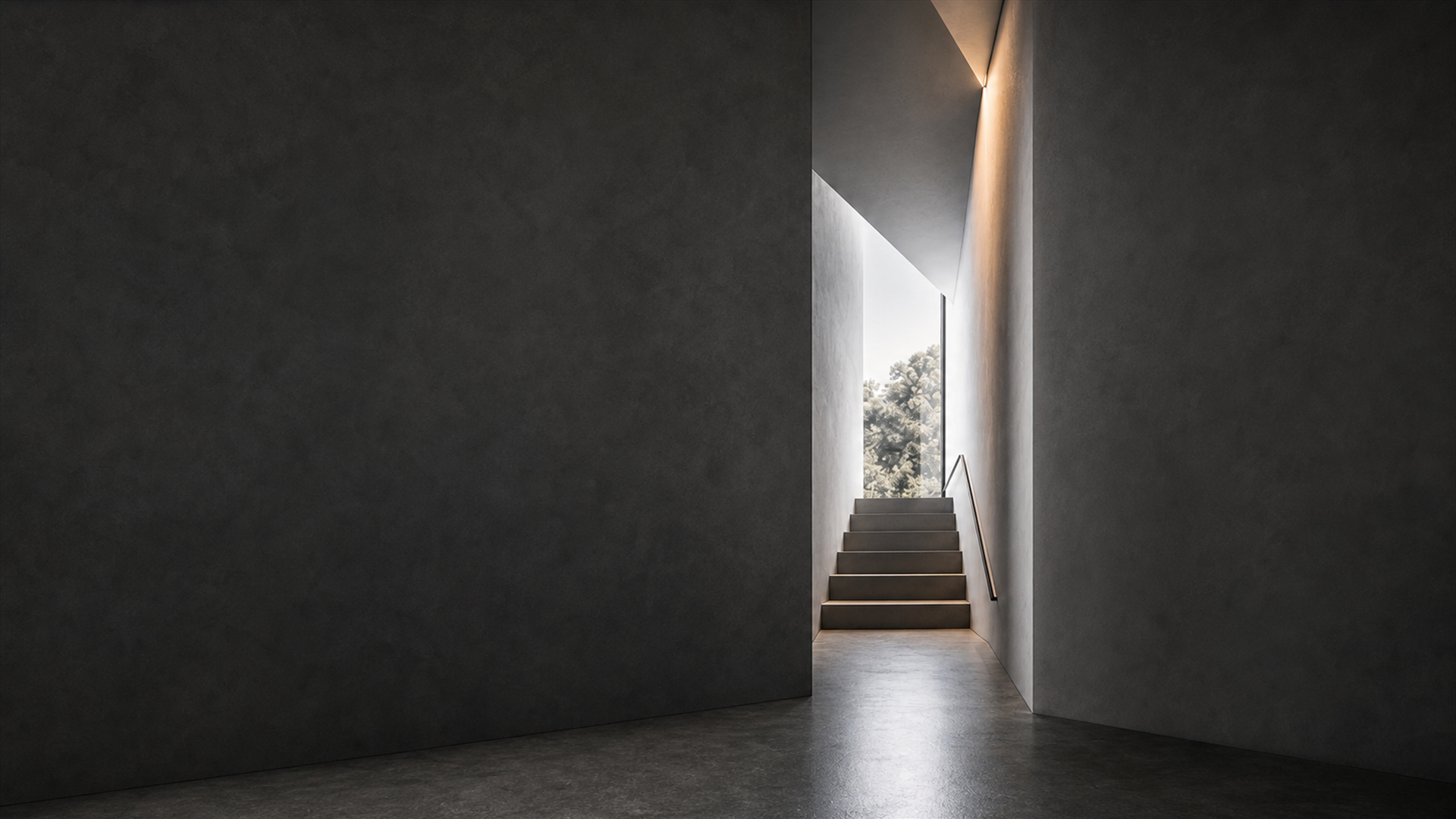 Charcoal architectural interior with a luminous stairwell opening to daylight