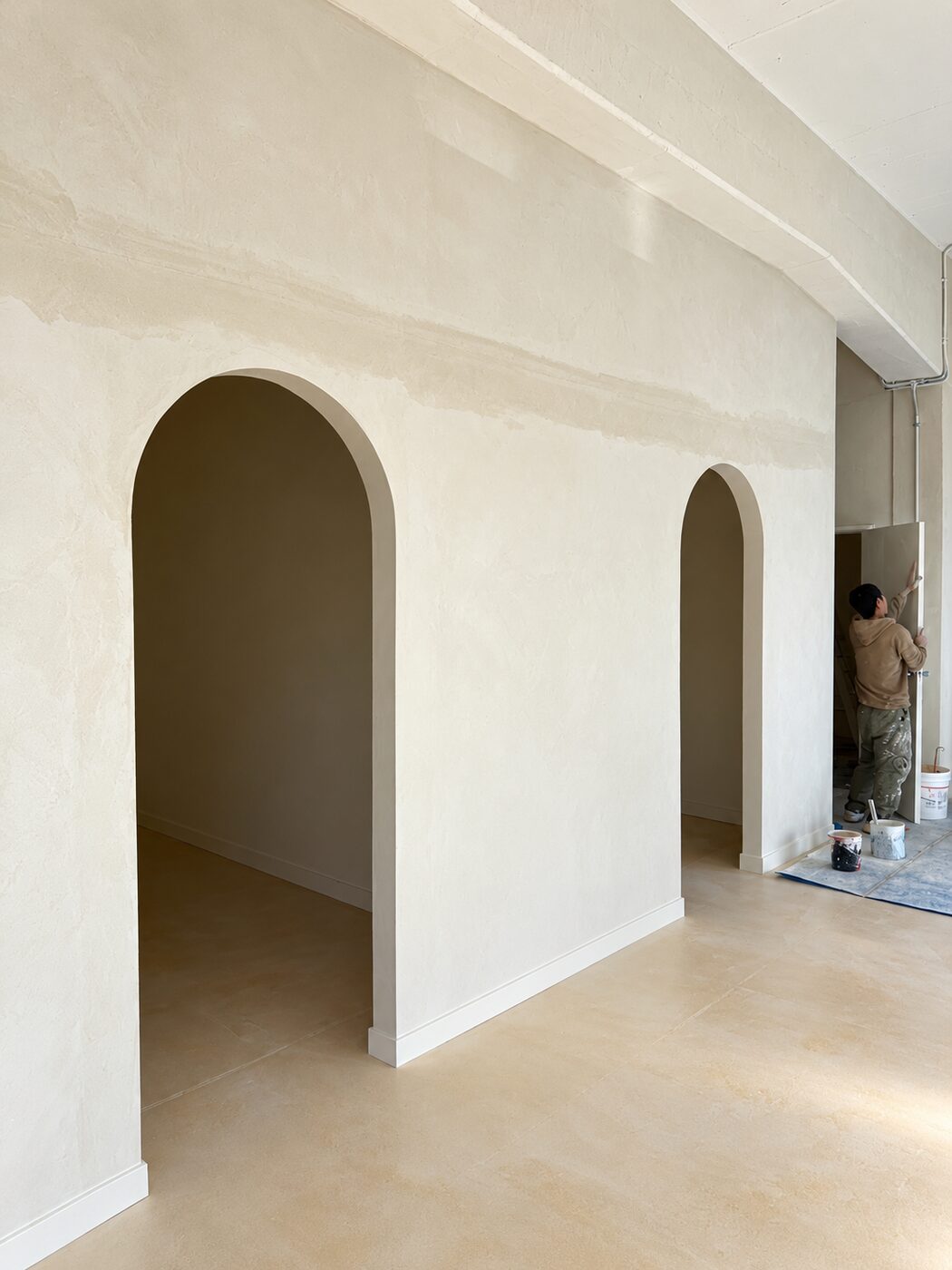 Hand-finished plaster wall with twin arched openings, No.1 Plastering and Painting